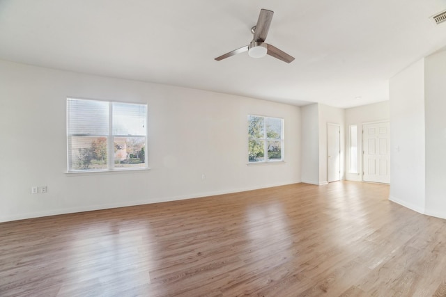 unfurnished room featuring ceiling fan and light hardwood / wood-style flooring