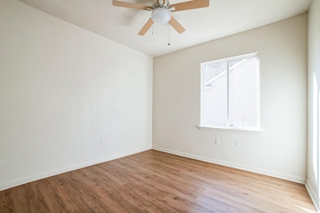 spare room featuring ceiling fan and light hardwood / wood-style floors