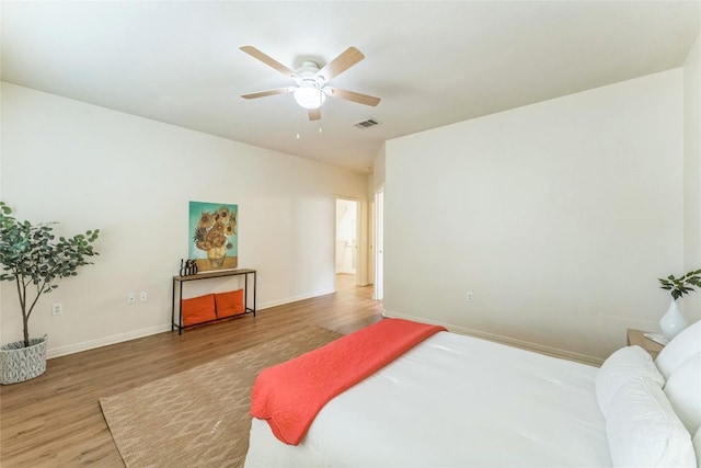 518 Texas Dr, Georgetown, TX 78633 - bedroom with wood finished floors, baseboards, and ceiling fan