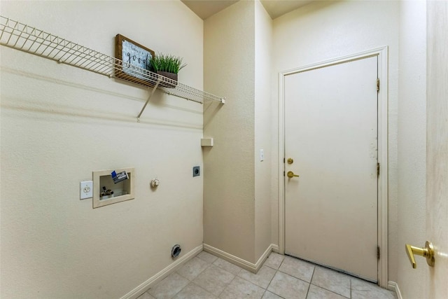 518 Texas Dr, Georgetown, TX 78633 - washroom featuring hookup for an electric dryer, hookup for a washing machine, baseboards, hookup for a gas dryer, and light tile patterned floors