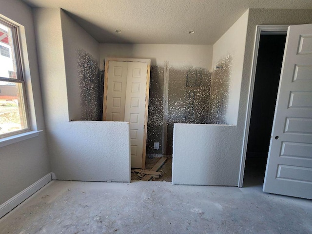 bathroom featuring a textured ceiling