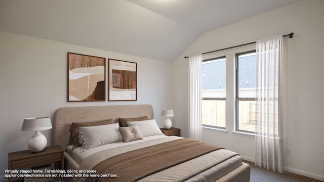 bedroom featuring carpet floors, lofted ceiling, and baseboards