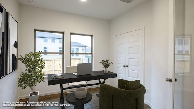 office featuring baseboards and wood finished floors