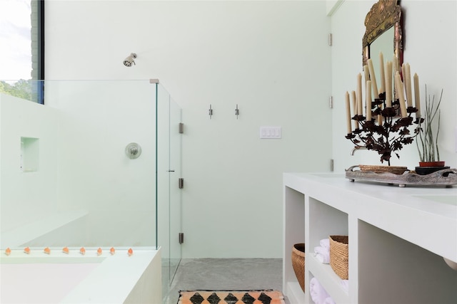 bathroom with vanity and a shower with shower door