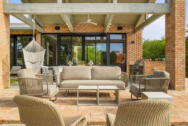 view of patio / terrace with an outdoor living space, area for grilling, and ceiling fan