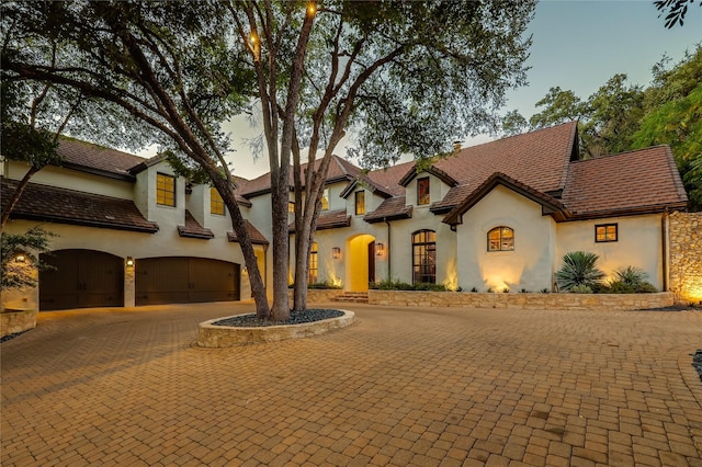 mediterranean / spanish-style home featuring a garage