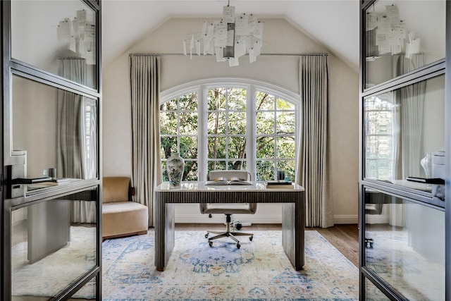 office area with hardwood / wood-style floors and vaulted ceiling