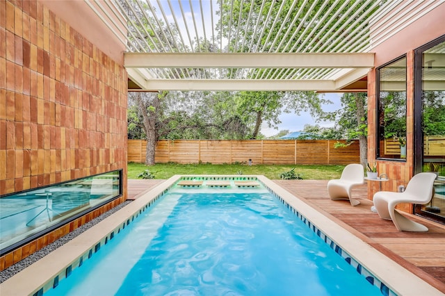 view of pool with a wooden deck