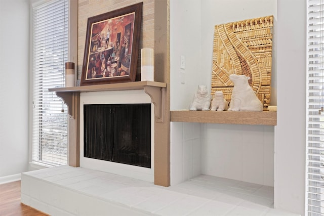 room details featuring a tiled fireplace