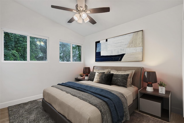 bedroom featuring lofted ceiling, ceiling fan, and dark wood-type flooring