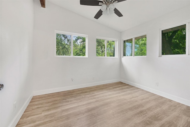 unfurnished room featuring ceiling fan, vaulted ceiling, and light wood-type flooring