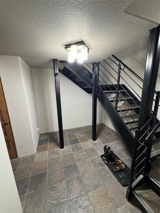 basement with a textured ceiling