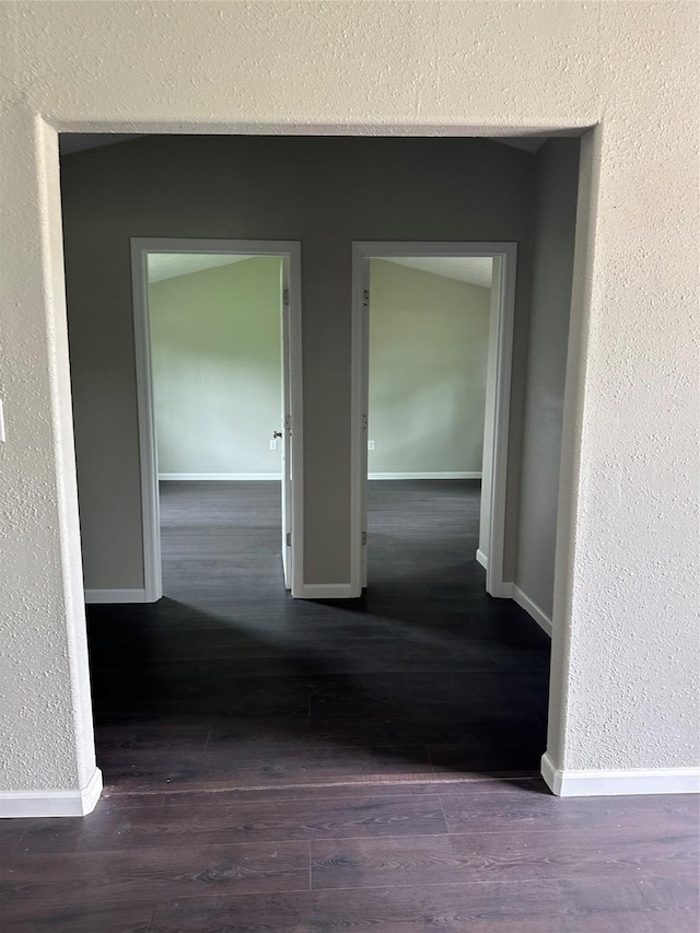 hall featuring dark wood-type flooring