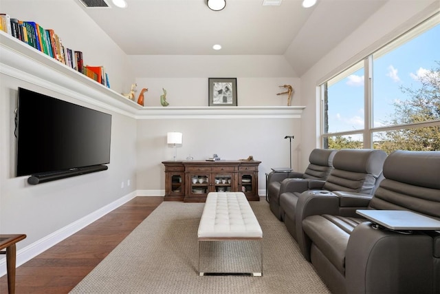 living room with recessed lighting, baseboards, and wood finished floors