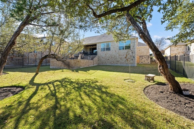 view of yard with a fenced backyard