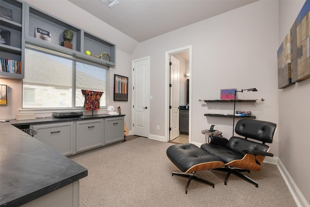 living area featuring light carpet, visible vents, and baseboards