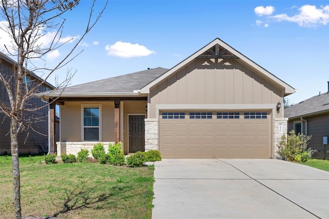 1420 Cliffbrake Way, Georgetown, TX 78626 - view of front of property featuring stone siding, board and batten siding, a garage, concrete driveway, and a front yard