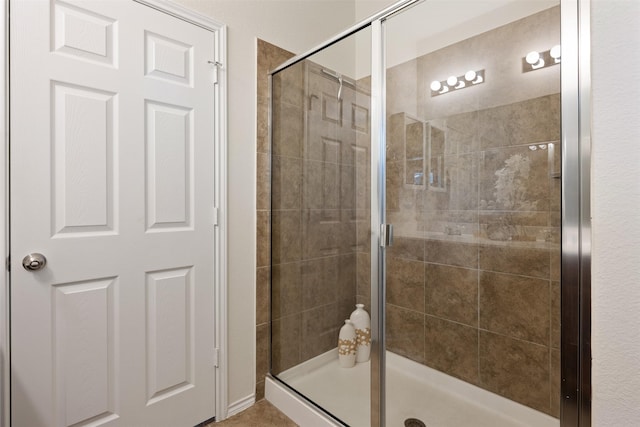 full bathroom featuring a shower stall