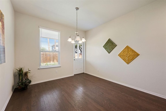 1420 Cliffbrake Way, Georgetown, TX 78626 - empty room with dark wood-style flooring and a chandelier
