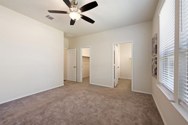 1420 Cliffbrake Way, Georgetown, TX 78626 - unfurnished bedroom with carpet floors, a walk in closet, ceiling fan, and a closet