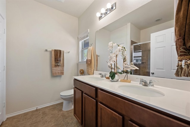 full bath featuring a sink, toilet, double vanity, and a tile shower