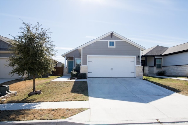 view of front of property featuring a garage and a front yard