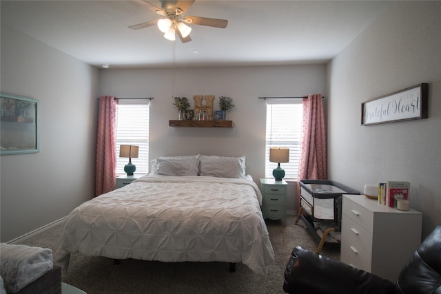 carpeted bedroom with multiple windows and ceiling fan