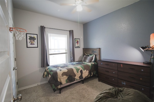 bedroom featuring ceiling fan and light carpet