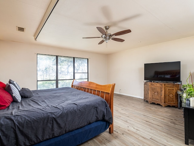 bedroom with ceiling fan and light wood-type flooring