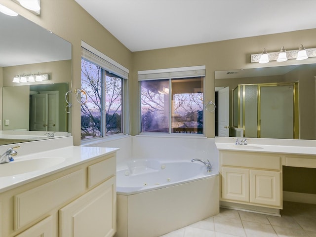 bathroom featuring vanity, tile patterned flooring, and plus walk in shower