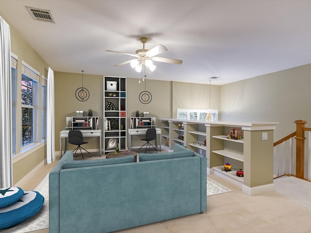 living room featuring ceiling fan and light carpet