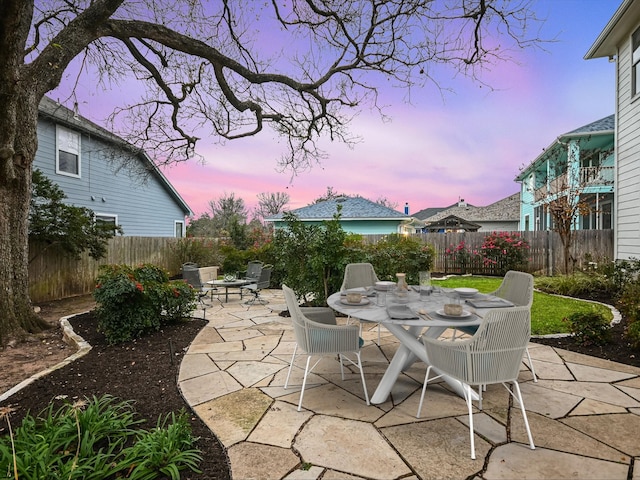 view of patio terrace at dusk