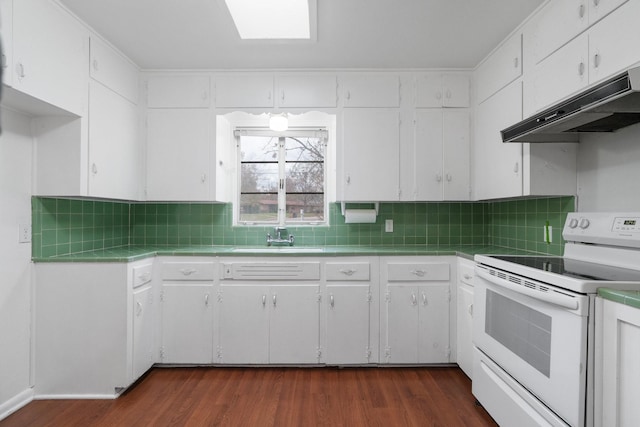 kitchen featuring backsplash, sink, white electric range oven, dark hardwood / wood-style flooring, and white cabinetry