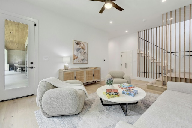 living room with hardwood / wood-style floors and ceiling fan