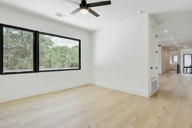 empty room featuring light hardwood / wood-style floors and ceiling fan