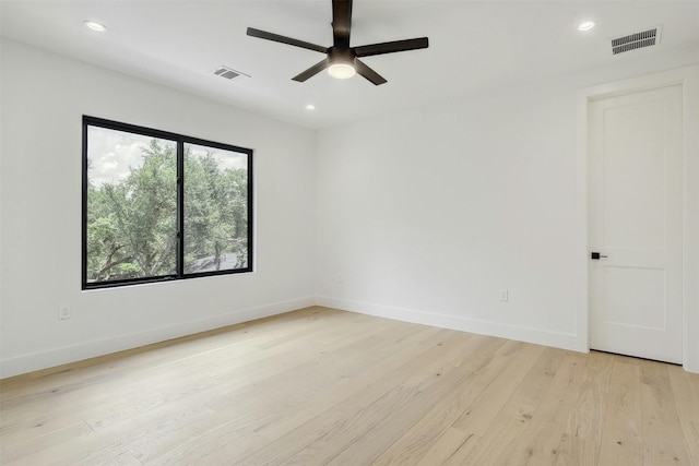 unfurnished room featuring ceiling fan and light hardwood / wood-style floors