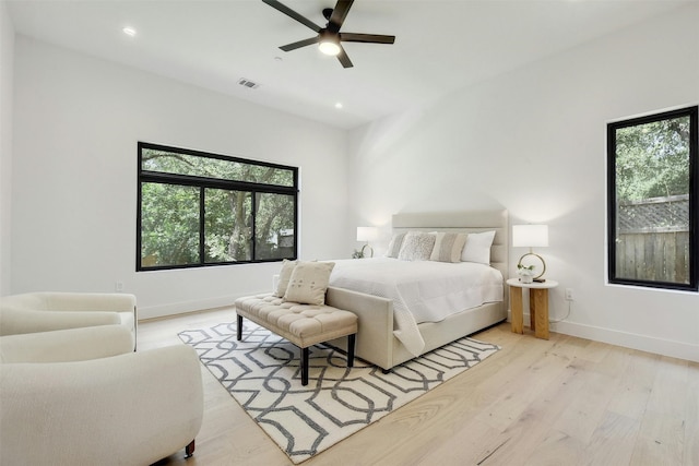 bedroom featuring ceiling fan and light hardwood / wood-style flooring