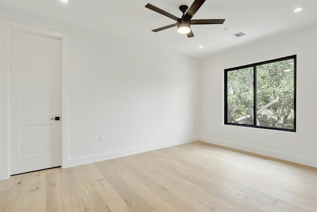 spare room with ceiling fan and light hardwood / wood-style flooring