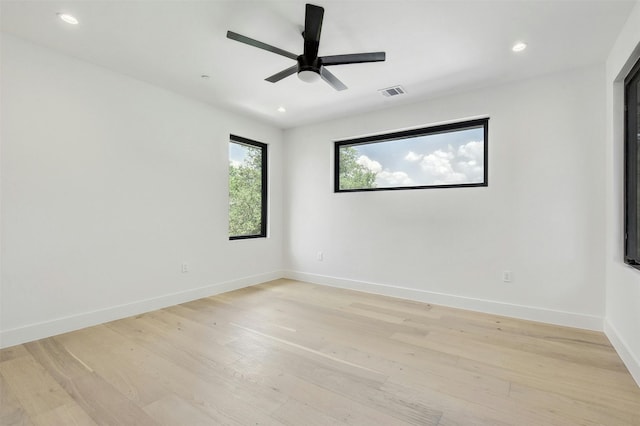 unfurnished room featuring light hardwood / wood-style floors and ceiling fan