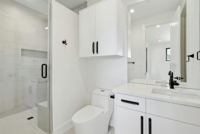 bathroom featuring vanity, toilet, and an enclosed shower