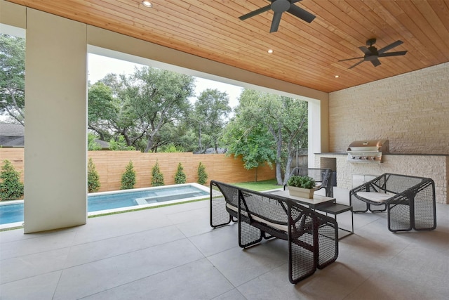 view of patio / terrace with a fenced in pool, a grill, and ceiling fan