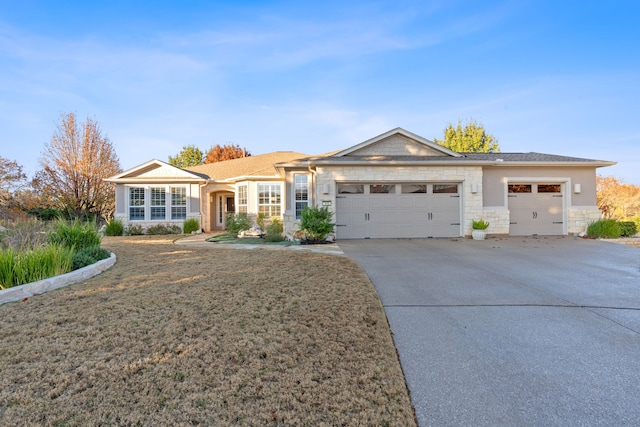 ranch-style home featuring a garage