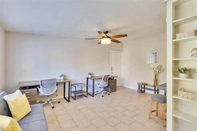 office area featuring ceiling fan, light tile patterned flooring, and built in features