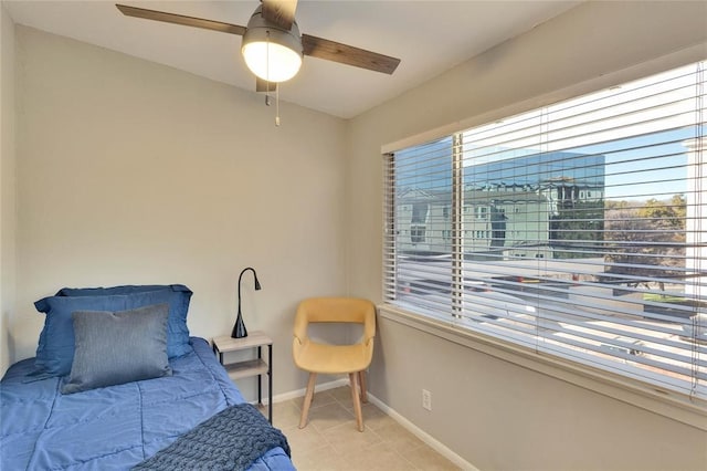 bedroom with light tile patterned floors and ceiling fan