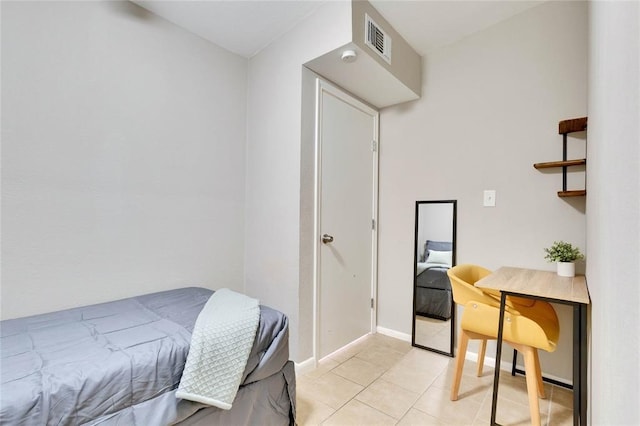 bedroom featuring light tile patterned floors