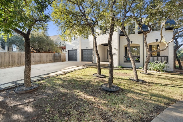 view of front facade featuring a garage and a front lawn