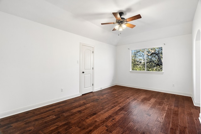 empty room featuring ceiling fan and dark hardwood / wood-style floors