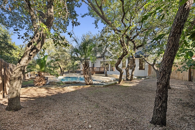 view of yard featuring a patio area and a pool side deck