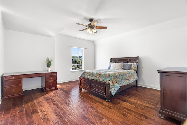 bedroom with dark hardwood / wood-style flooring and ceiling fan