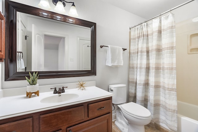 full bathroom with vanity, toilet, and shower / bath combo with shower curtain